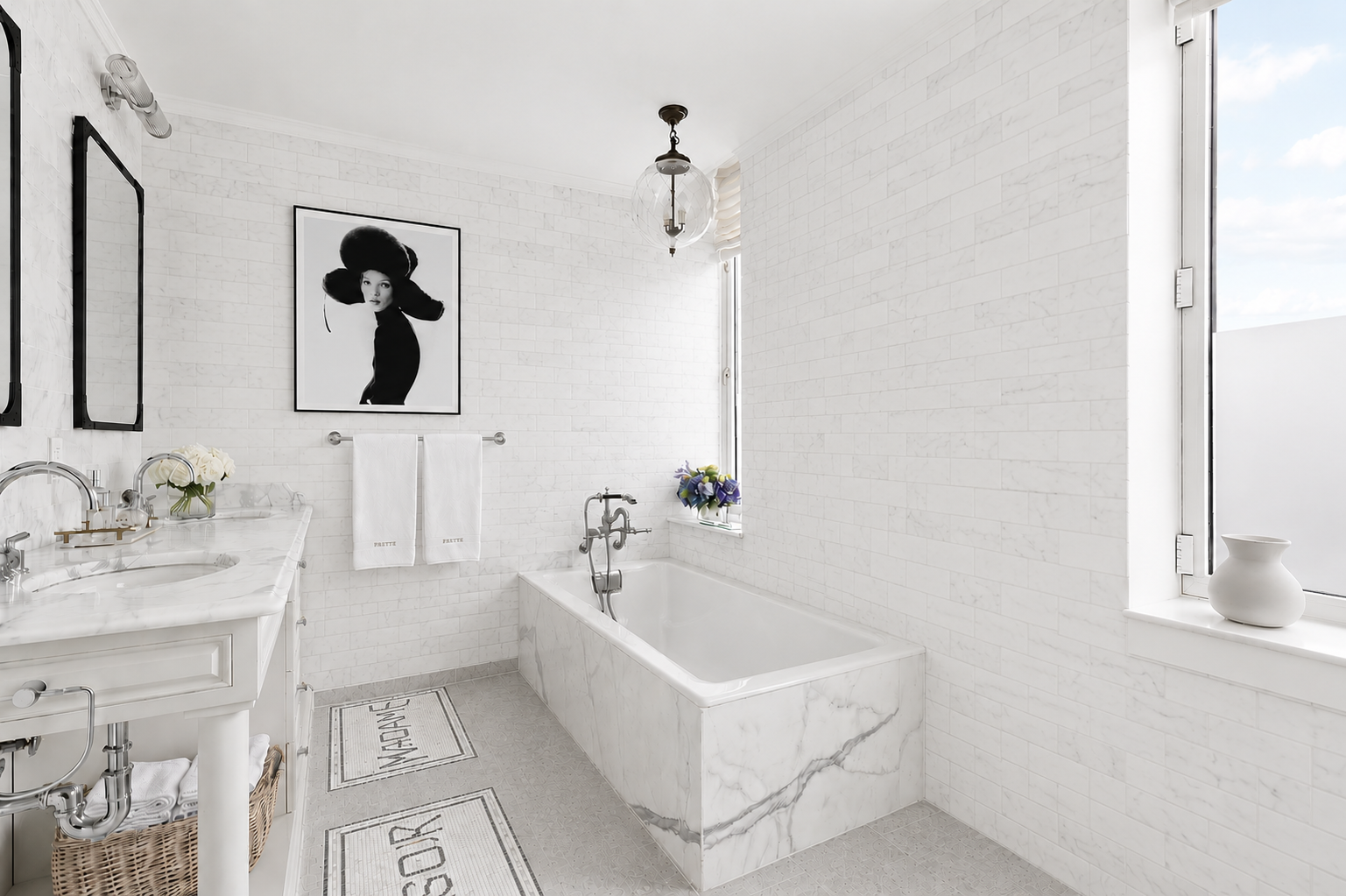 White marble bathroom with marble tile walls and tub surround